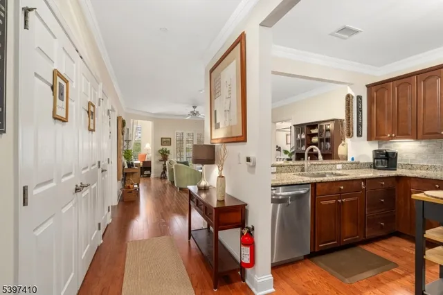 a kitchen with stainless steel appliances granite countertop sink stove and cabinets