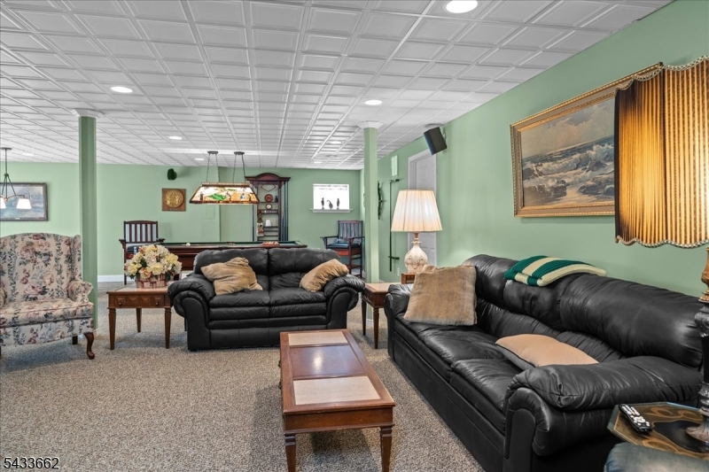 15 Bracken Hill Road Hamburg, NJ 07419 - Photo 33 of 44 a living room with furniture and a couch