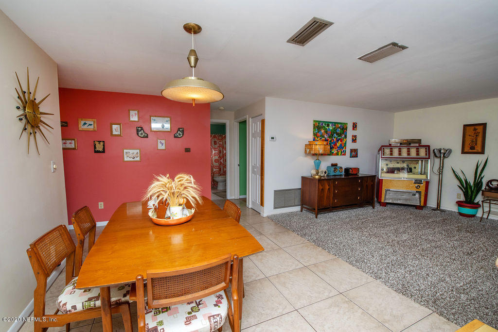 843 Viscaya Boulevard St. Augustine, FL 32086 - Photo 11 of 33 a view of a dining room with furniture and chandelier