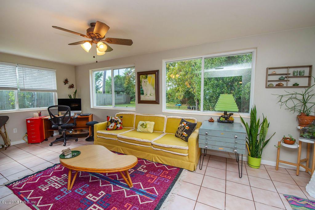 843 Viscaya Boulevard St. Augustine, FL 32086 - Photo 13 of 33 a living room with furniture and a large window