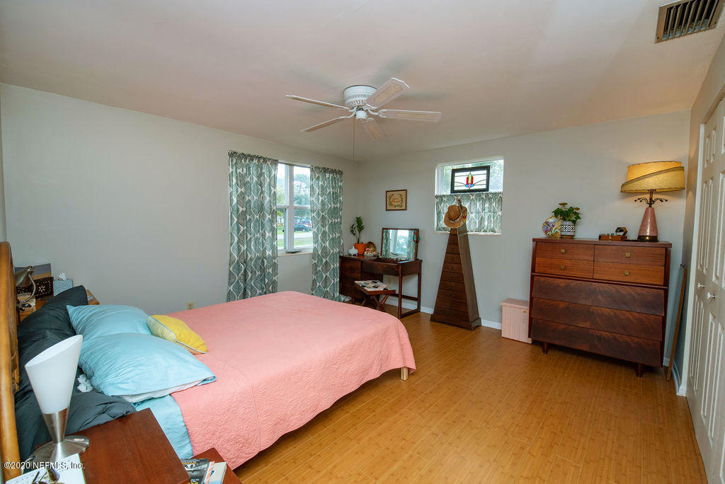 843 Viscaya Boulevard St. Augustine, FL 32086 - Photo 17 of 33 a bedroom with a bed and wooden floor