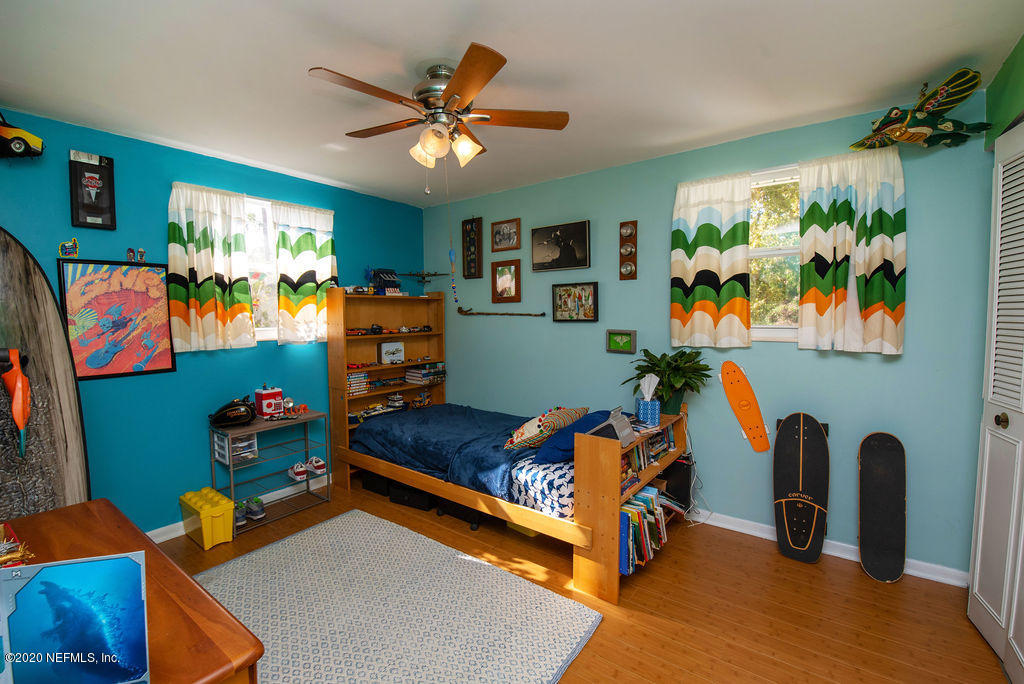 843 Viscaya Boulevard St. Augustine, FL 32086 - Photo 20 of 33 a bedroom with furniture and a flat screen tv