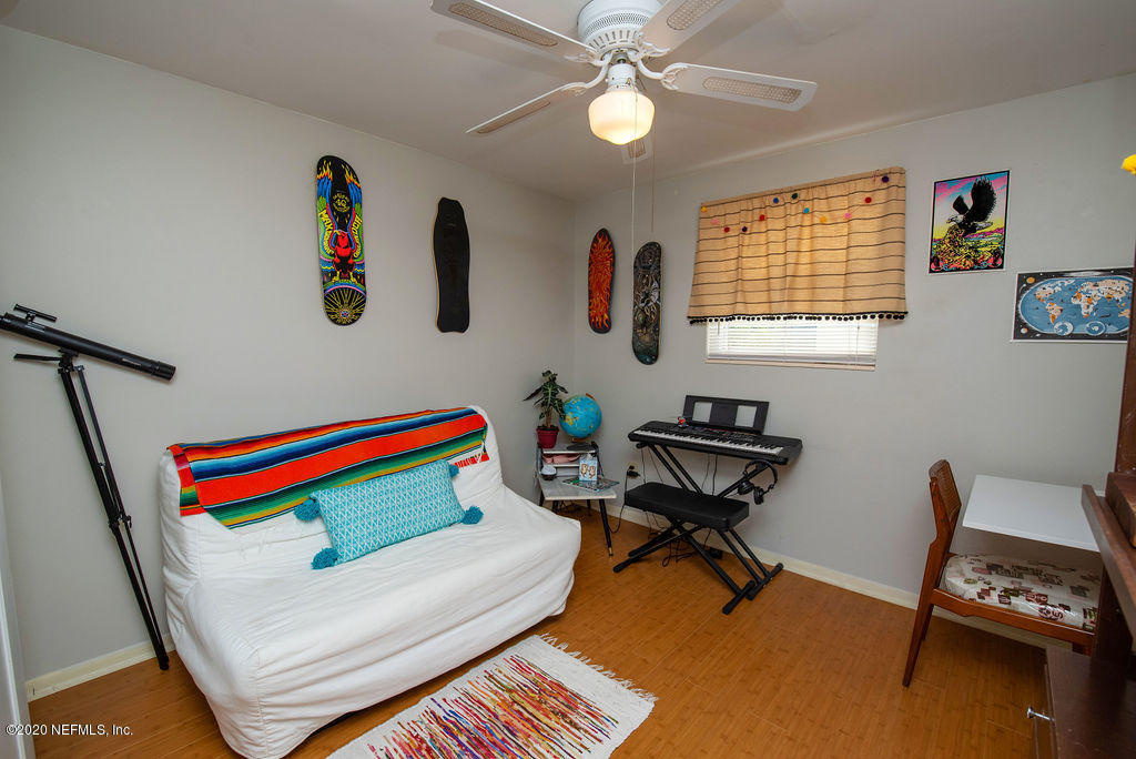 843 Viscaya Boulevard St. Augustine, FL 32086 - Photo 22 of 33 a living room with furniture and a wooden floor