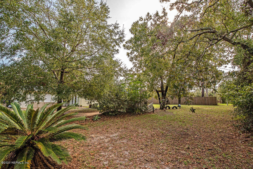 843 Viscaya Boulevard St. Augustine, FL 32086 - Photo 25 of 33 a view of dirt field with trees