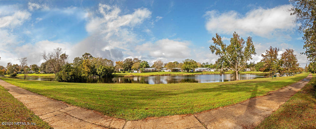 843 Viscaya Boulevard St. Augustine, FL 32086 - Photo 33 of 33 a view of a lake with a big yard