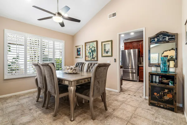a kitchen with stainless steel appliances granite countertop a refrigerator sink and cabinets