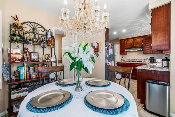 a large bed sitting in a bedroom next to a window
