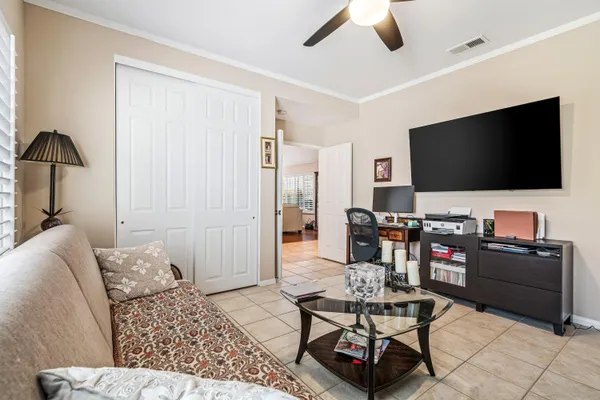 a bathroom with a granite countertop toilet and a sink