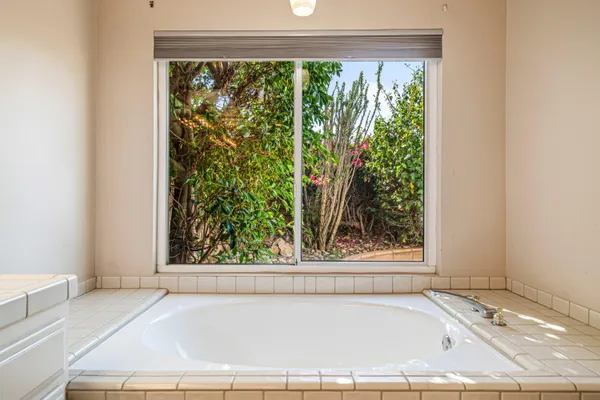 a outdoor space with patio fireplace and a potted plant