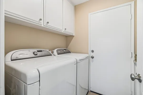 a view of a house with backyard sitting area and porch
