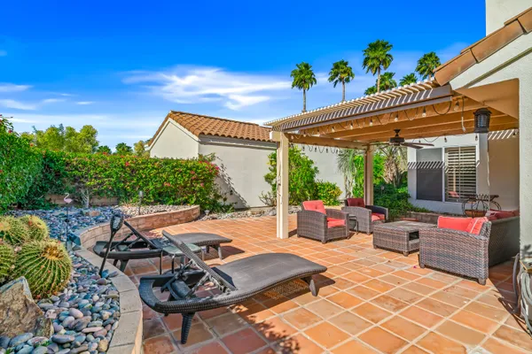 a view of a garden with small houses