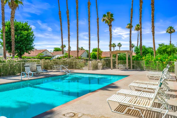 a view of a swimming pool with a patio