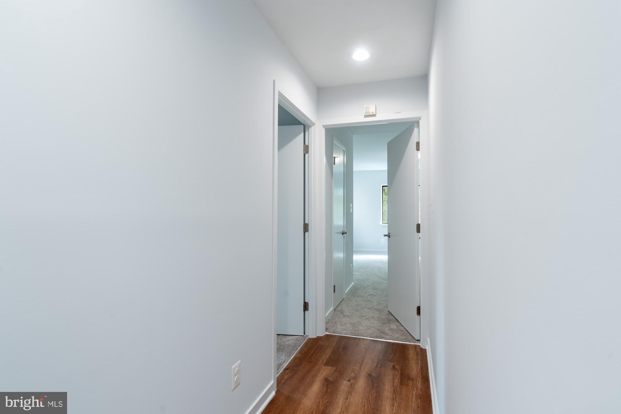 11500 Fairway Drive, Unit 401 Reston, VA 20190 - Photo 23 of 36 Hallway to Primary and secondary bedrooms