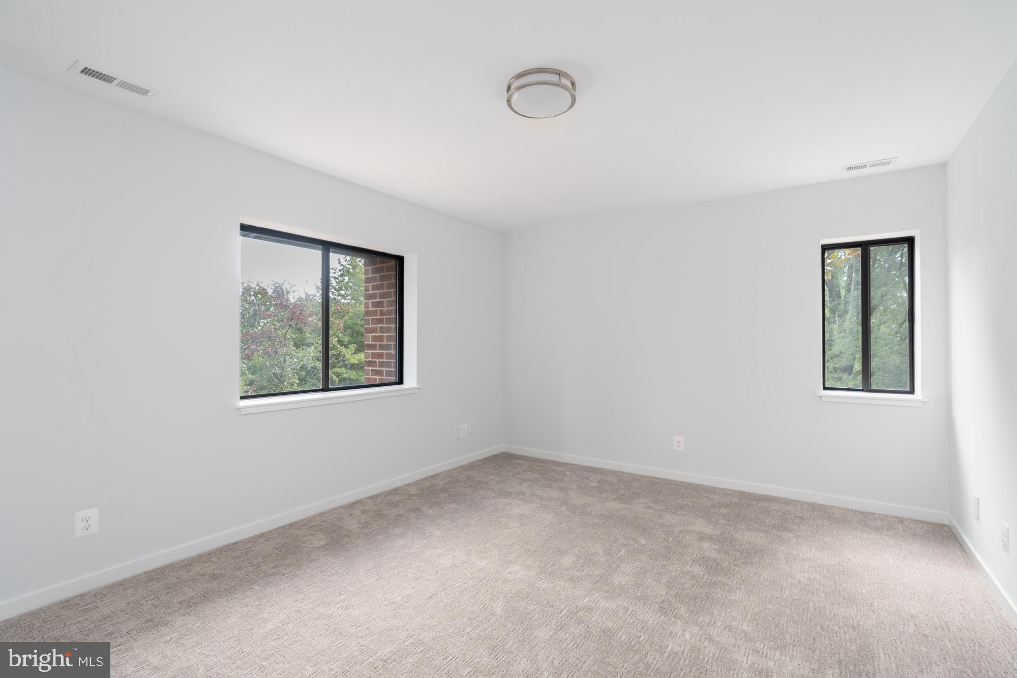 11500 Fairway Drive, Unit 401 Reston, VA 20190 - Photo 24 of 36 Bedroom 2 features two windows and walk in closet