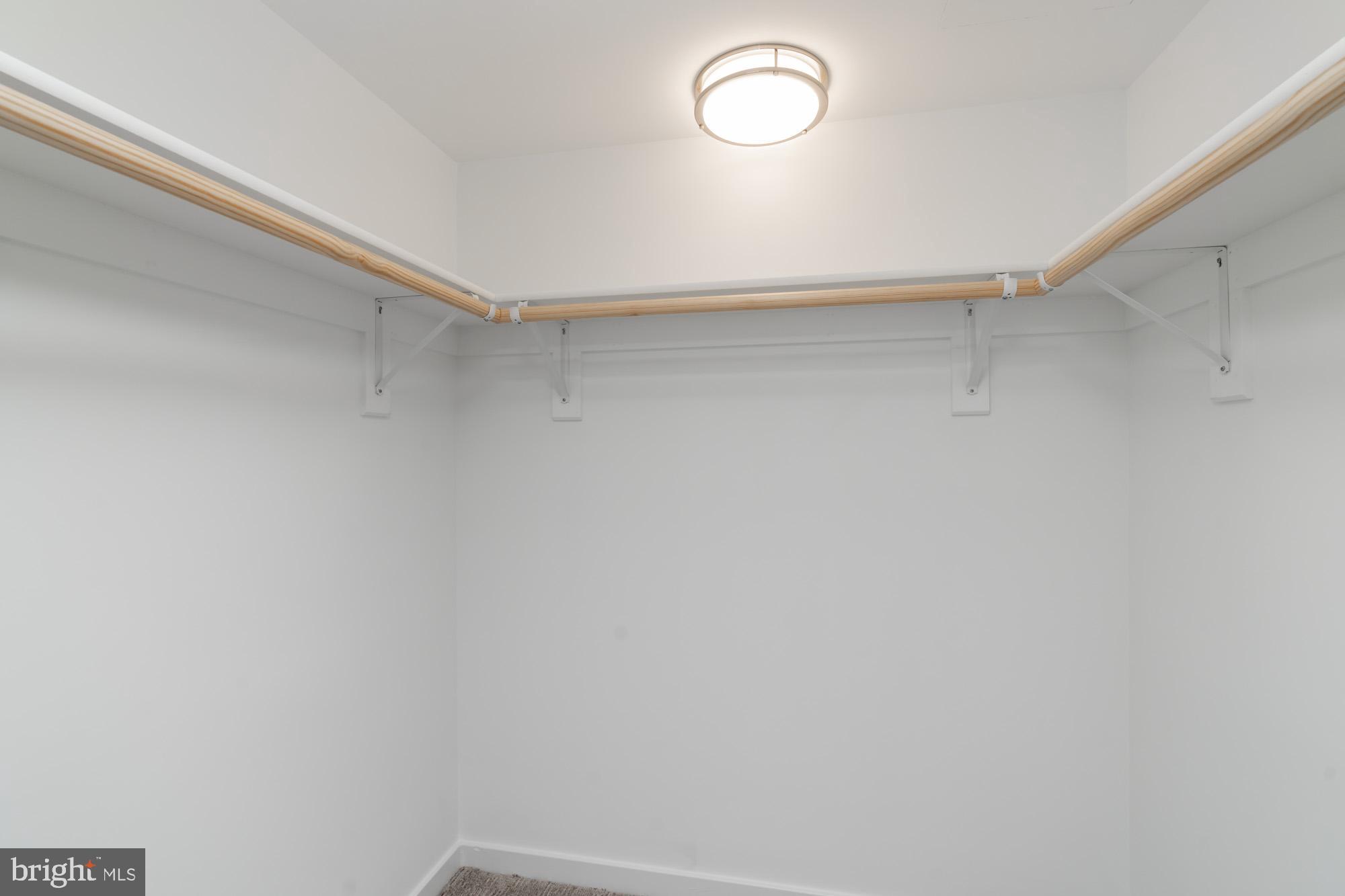 11500 Fairway Drive, Unit 401 Reston, VA 20190 - Photo 26 of 36 Bedroom 2 walk in closet - solid wood shelf & rod