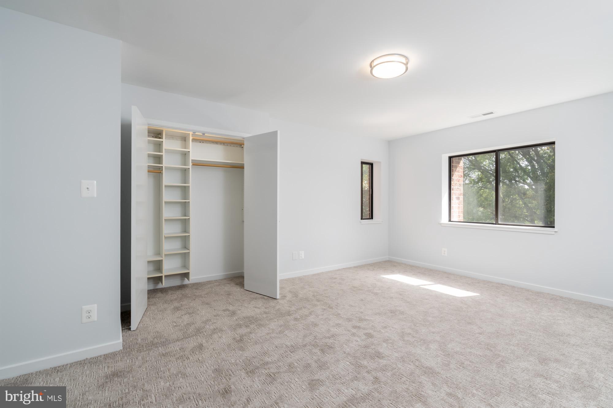 11500 Fairway Drive, Unit 401 Reston, VA 20190 - Photo 28 of 36 Primary Bedroom - walk-in and reach-in closets