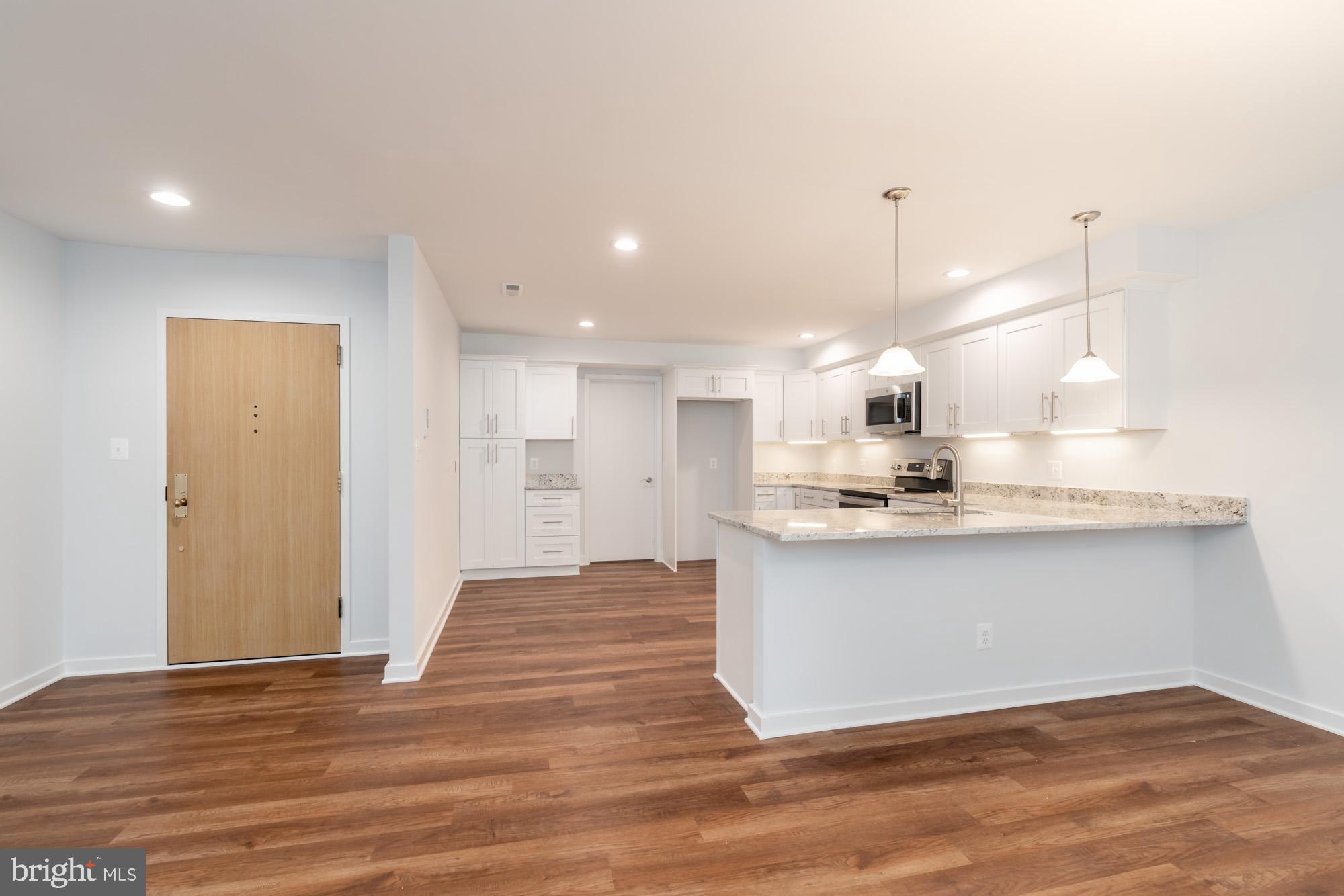 11500 Fairway Drive, Unit 401 Reston, VA 20190 - Photo 6 of 36 Foyer/Kitchen/Dining Room