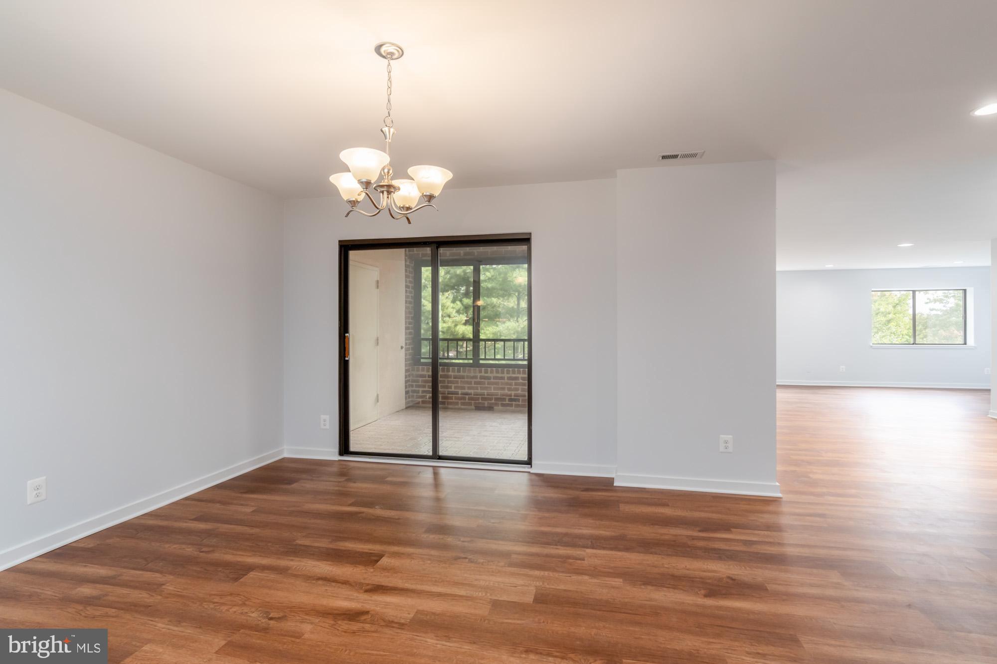 11500 Fairway Drive, Unit 401 Reston, VA 20190 - Photo 8 of 36 Dining Room looking into the Sunroom/Family Room