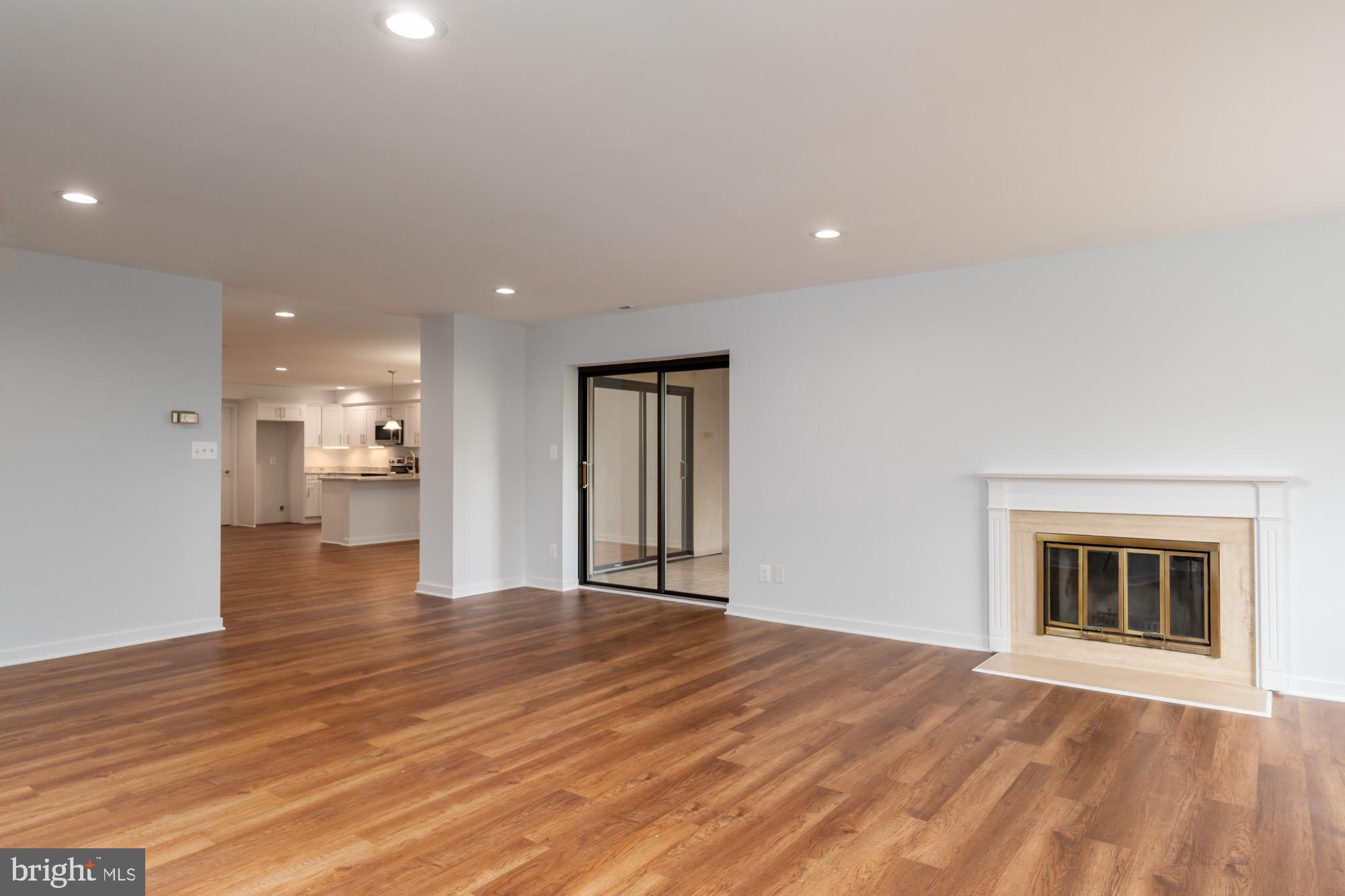 11500 Fairway Drive, Unit 401 Reston, VA 20190 - Photo 10 of 36 Family Room looking into dining room and kitchen