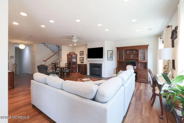 a living room with fireplace furniture and a flat screen tv