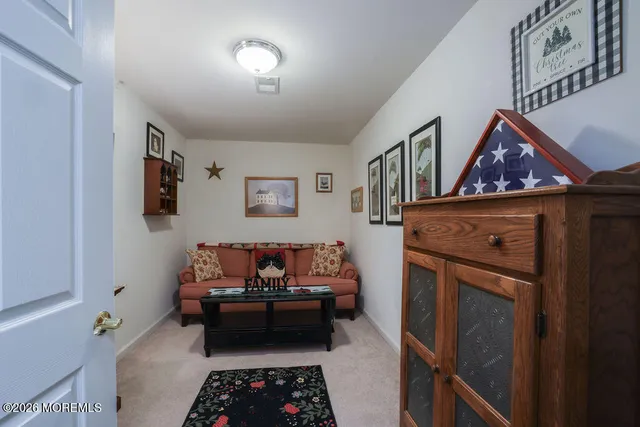a bedroom with furniture and a baby crib