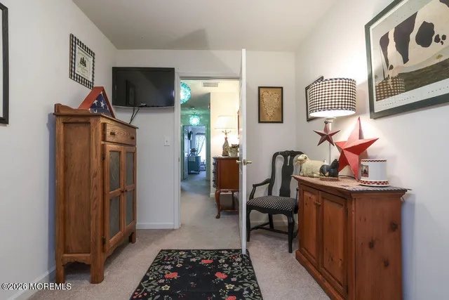 a bedroom with furniture and a window
