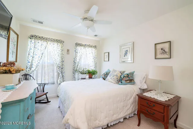 a bedroom with a bed and a table in it