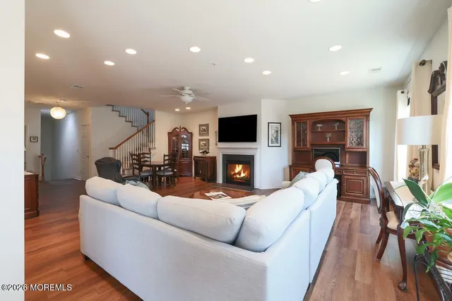 a living room with fireplace furniture and a flat screen tv