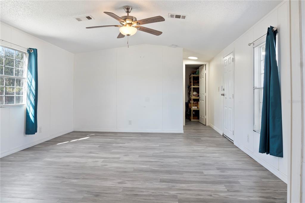 6526 Jack Street Punta Gorda, FL 33982 - Photo 11 of 19 wooden floor in an empty room with a window