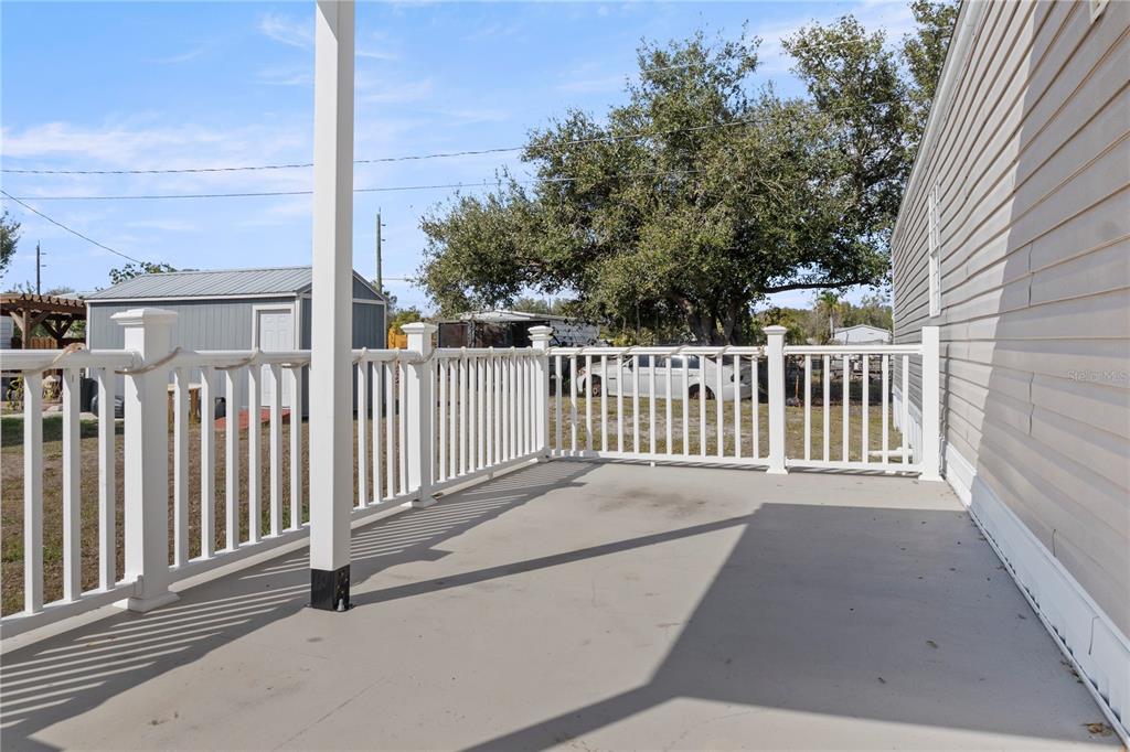 6526 Jack Street Punta Gorda, FL 33982 - Photo 15 of 19 a view of a balcony with wooden fence
