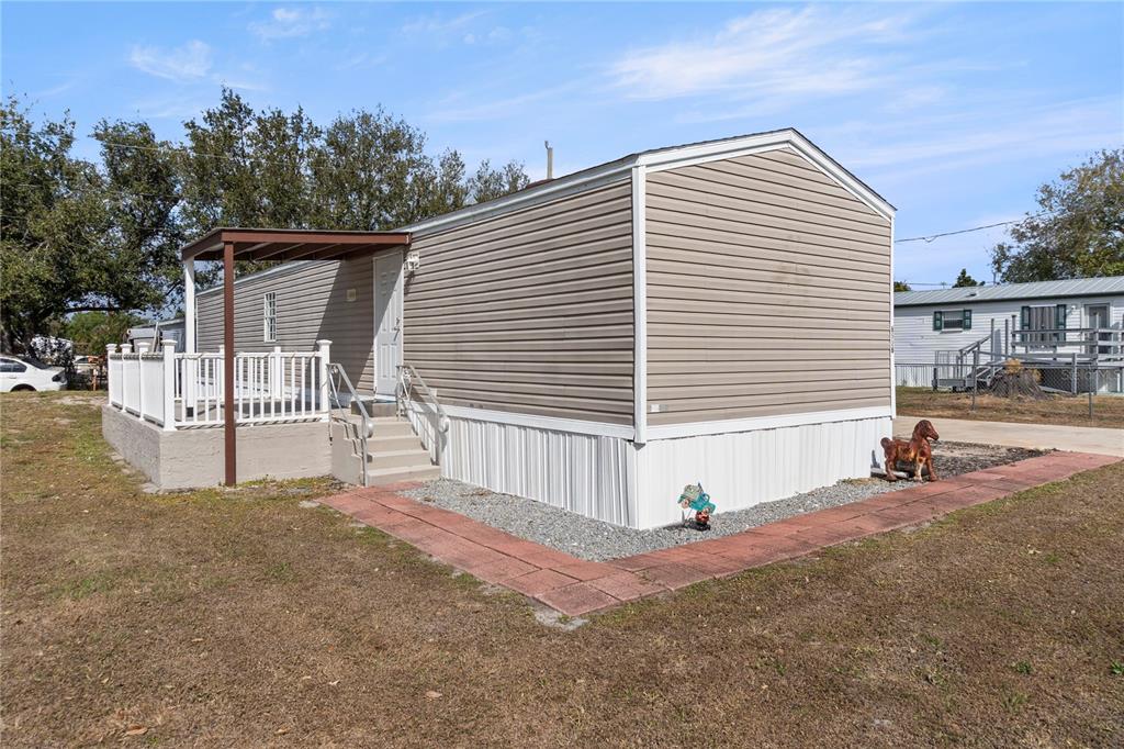6526 Jack Street Punta Gorda, FL 33982 - Photo 16 of 19 a front view of a house with a garage