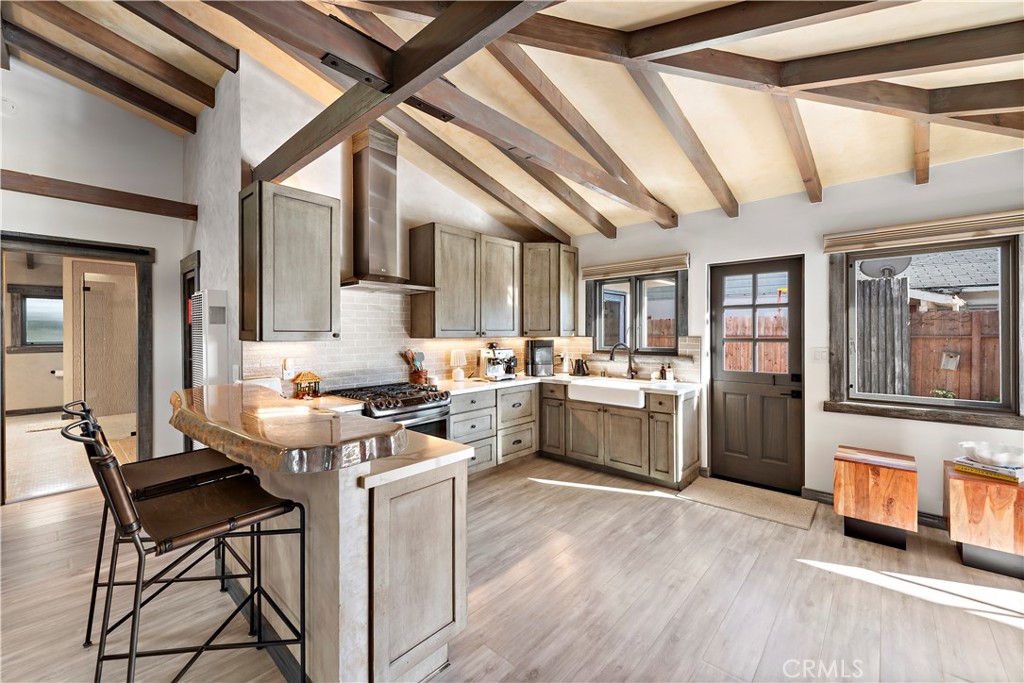1209 C. Toledo San Clemente, CA 92672 - Photo 14 of 47 a kitchen with a stove a refrigerator and a stove