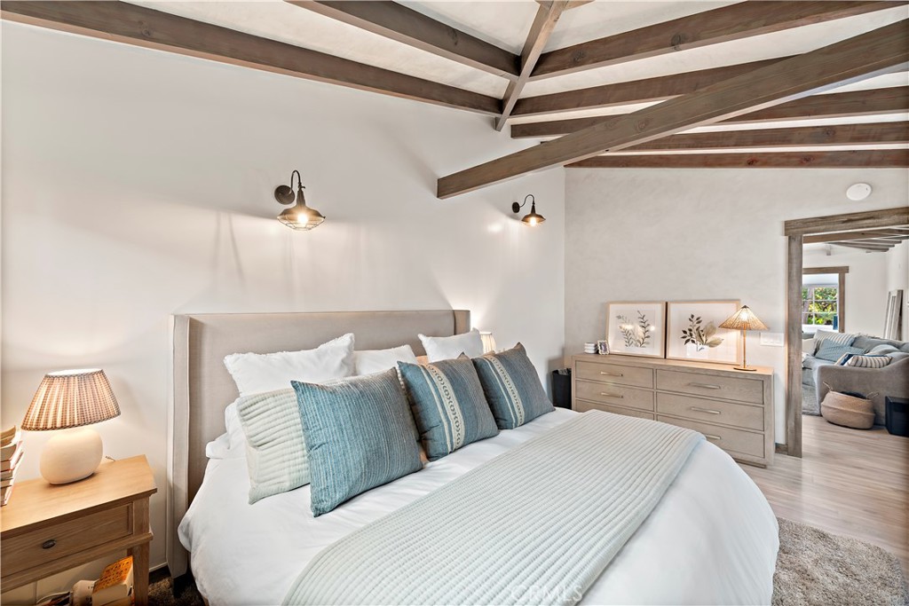 1209 C. Toledo San Clemente, CA 92672 - Photo 28 of 47 a bedroom with a bed and wooden floor