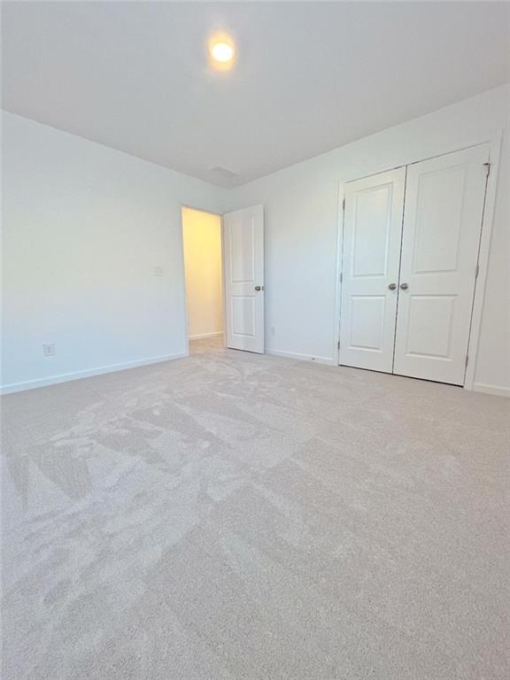 117 Goshawk Street Braselton, GA 30517 - Photo 17 of 28 a view of an empty room with a window