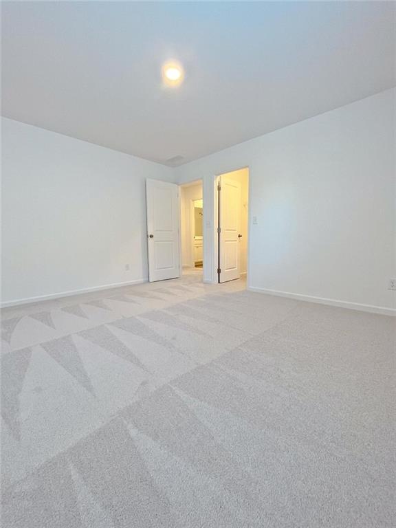 117 Goshawk Street Braselton, GA 30517 - Photo 18 of 28 a view of an empty room with a window