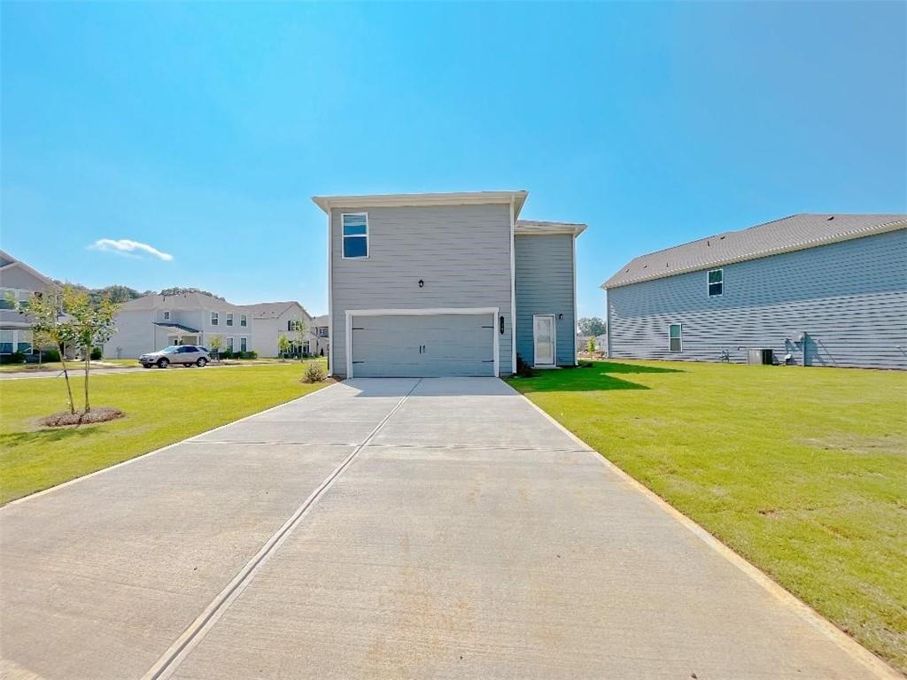 117 Goshawk Street Braselton, GA 30517 - Photo 27 of 28 a view of a house with a swimming pool