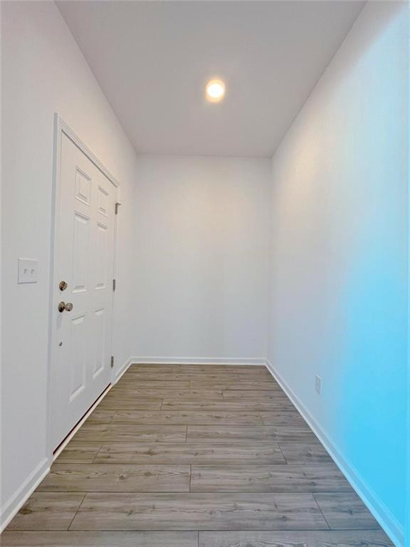 117 Goshawk Street Braselton, GA 30517 - Photo 4 of 28 a view of a room with wooden floor