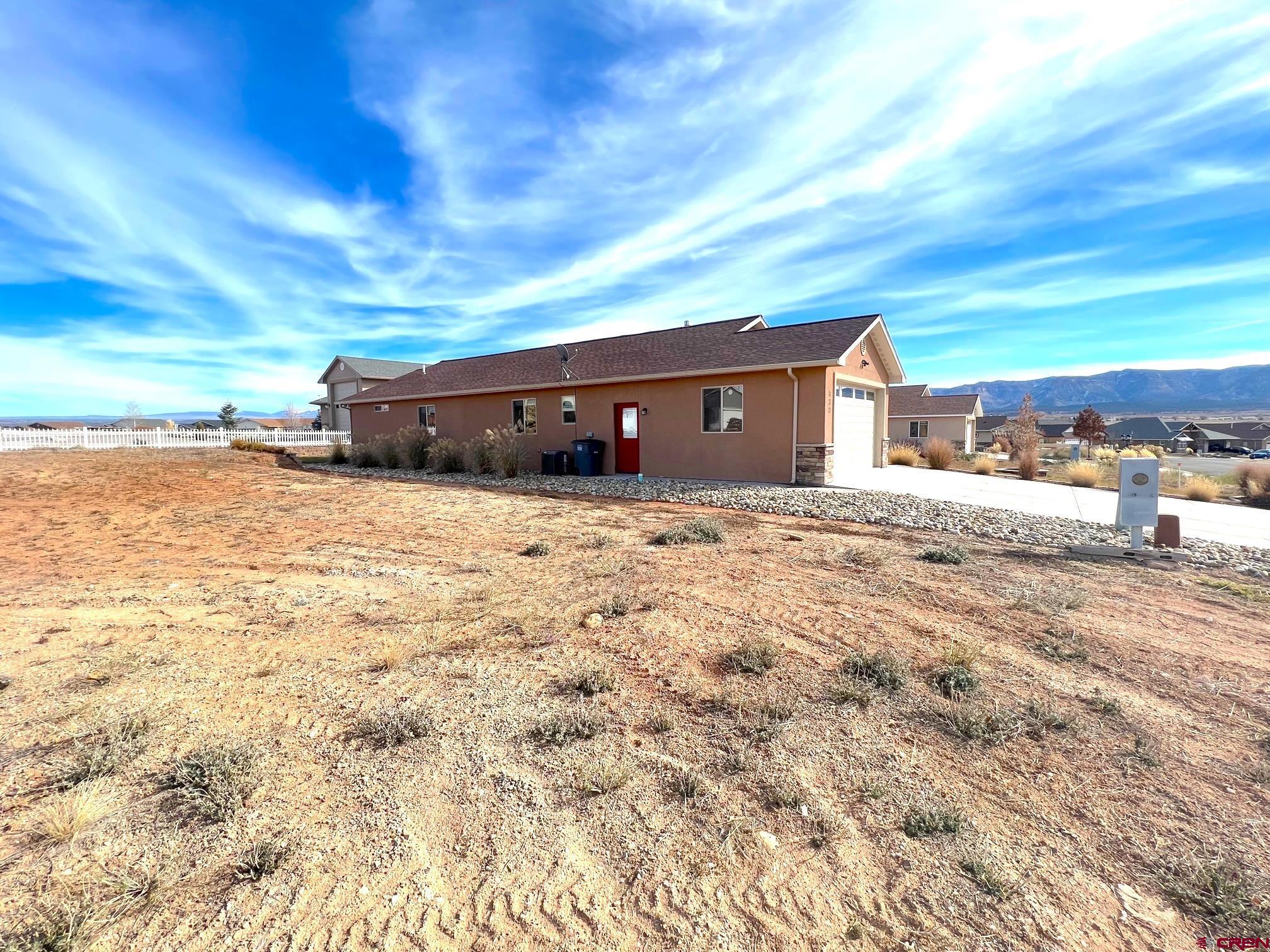 930 Bluffs Boulevard Cortez, CO 81321 - Photo 28 of 28 a view of a house with a yard