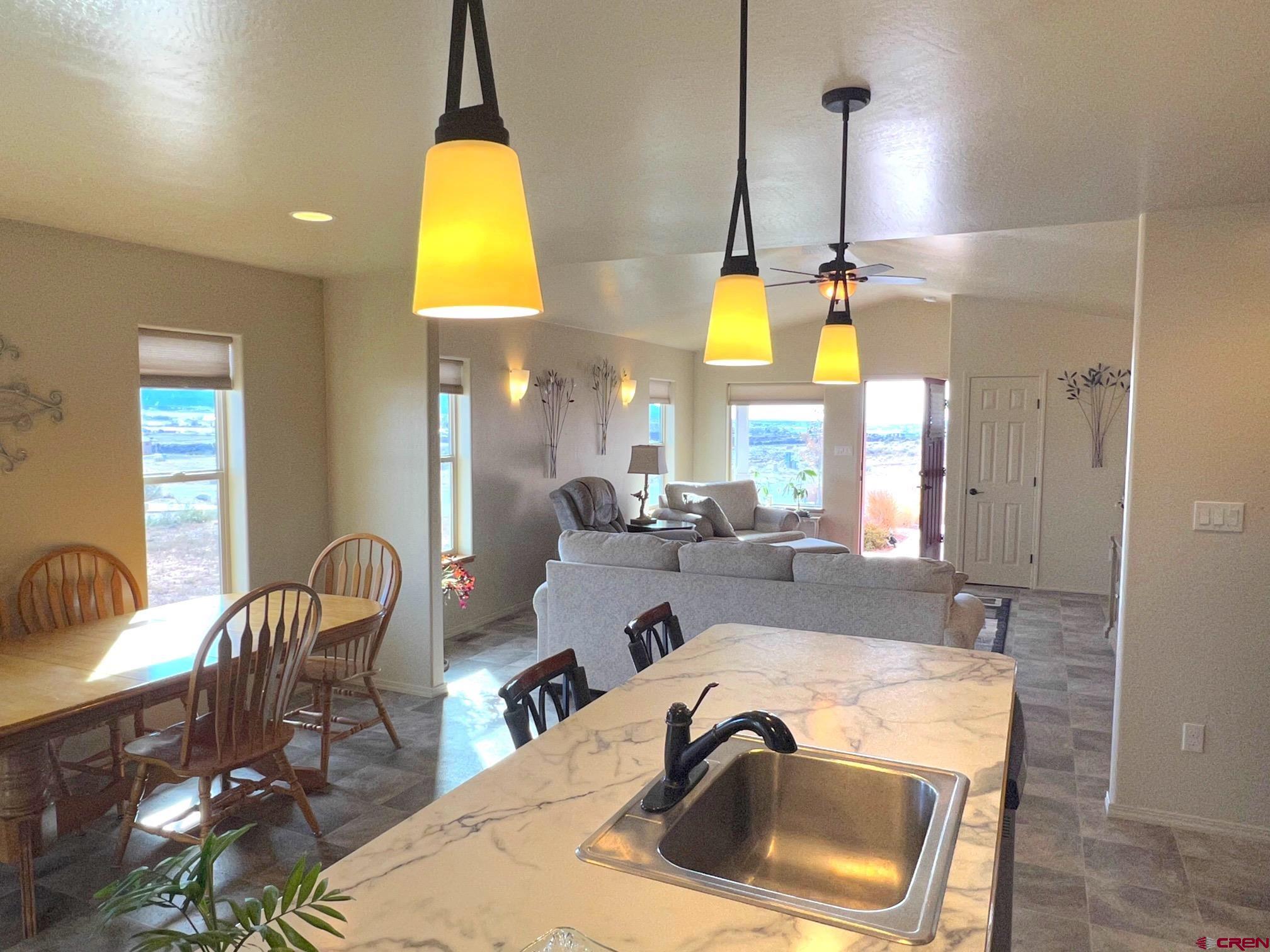 930 Bluffs Boulevard Cortez, CO 81321 - Photo 8 of 28 a bathroom with a tub sink and mirror