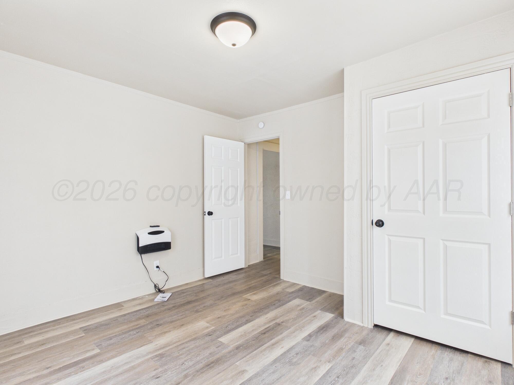 1111 Southwest 13th Avenue Amarillo, TX 79102 - Photo 18 of 20 a view of empty room with wooden floor