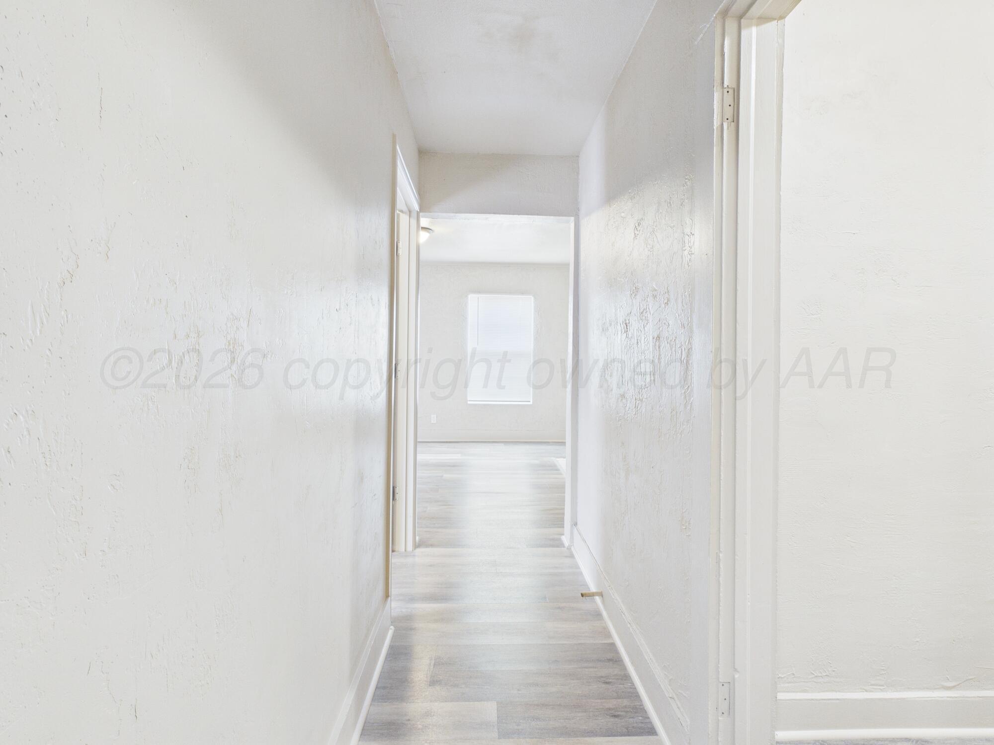 1111 Southwest 13th Avenue Amarillo, TX 79102 - Photo 6 of 20 a view of a bathroom from a hallway