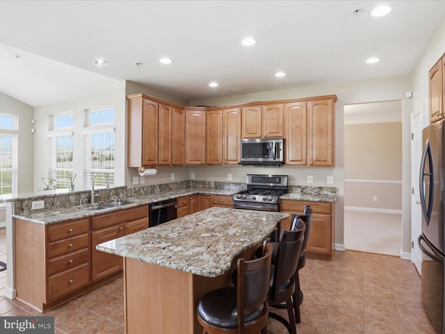14202 Derby Ridge Road Bowie, MD 20721 - Photo 17 of 57 CENTER IDLAND WITH BAR, EXTRA CABINETS