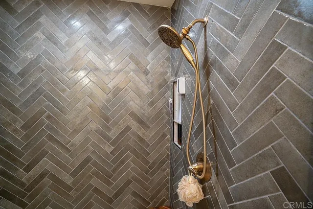 a bathroom with a shower and a mirror