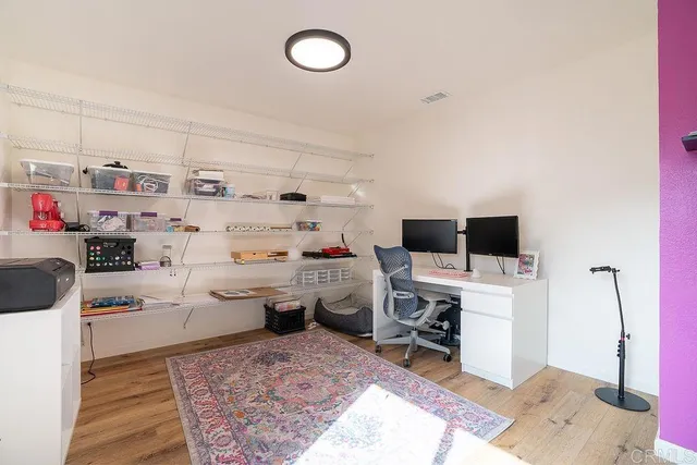 a view of a workspace with furniture