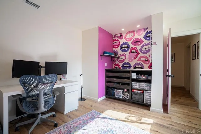 a bedroom with furniture and a window