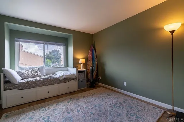 a bed room with a bed and a window