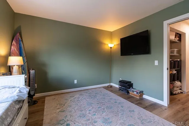 a view of a livingroom with wooden floor