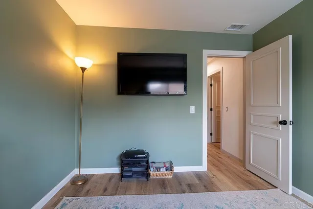 a view of storage and utility room with a window