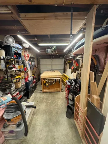 a view of a swimming pool with an outdoor seating and a lots of buildings in the background