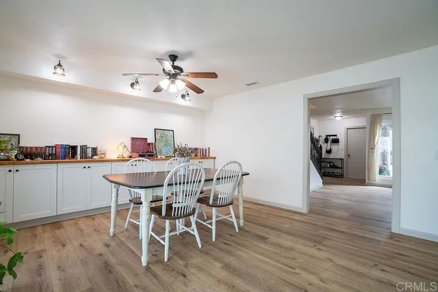 a kitchen with a refrigerator sink and cabinets